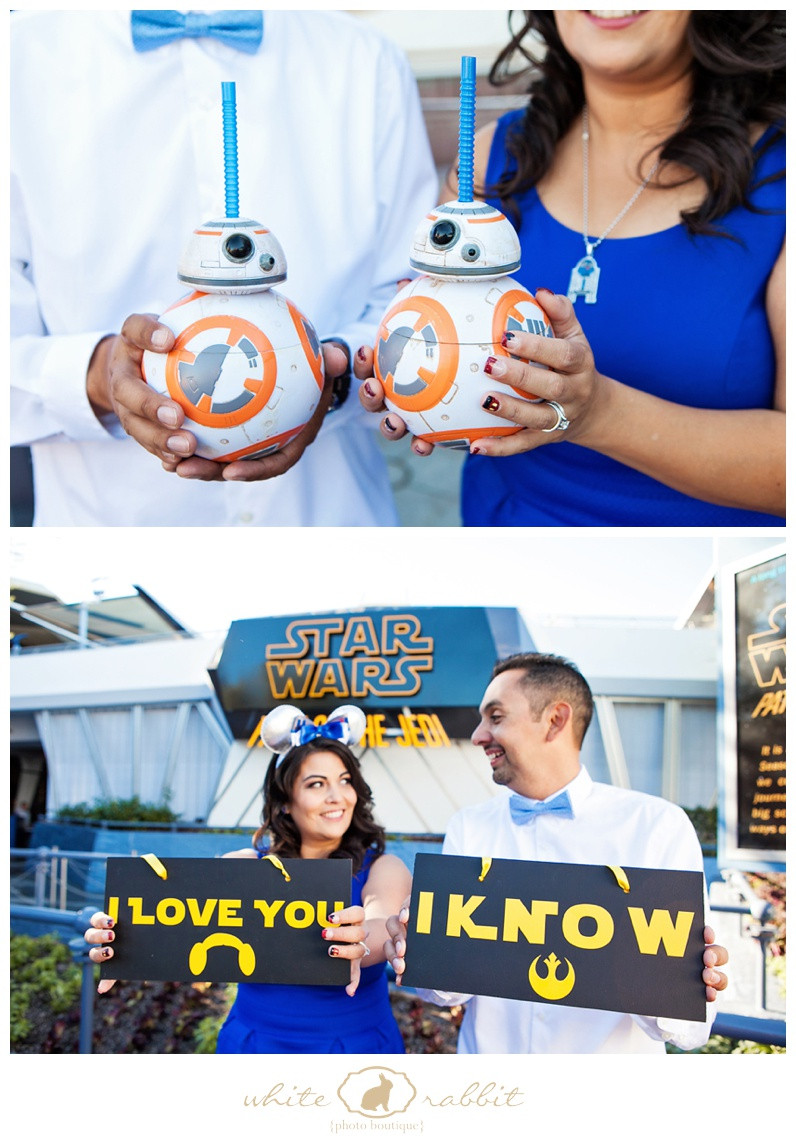 A couple kisses romantically with lightsabers crossed in the background in a Star Wars themed engagement photo shoot.