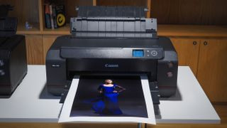 Canon ImagePrograf Pro-1100 printer in a wooden-interior studio, printing photographs