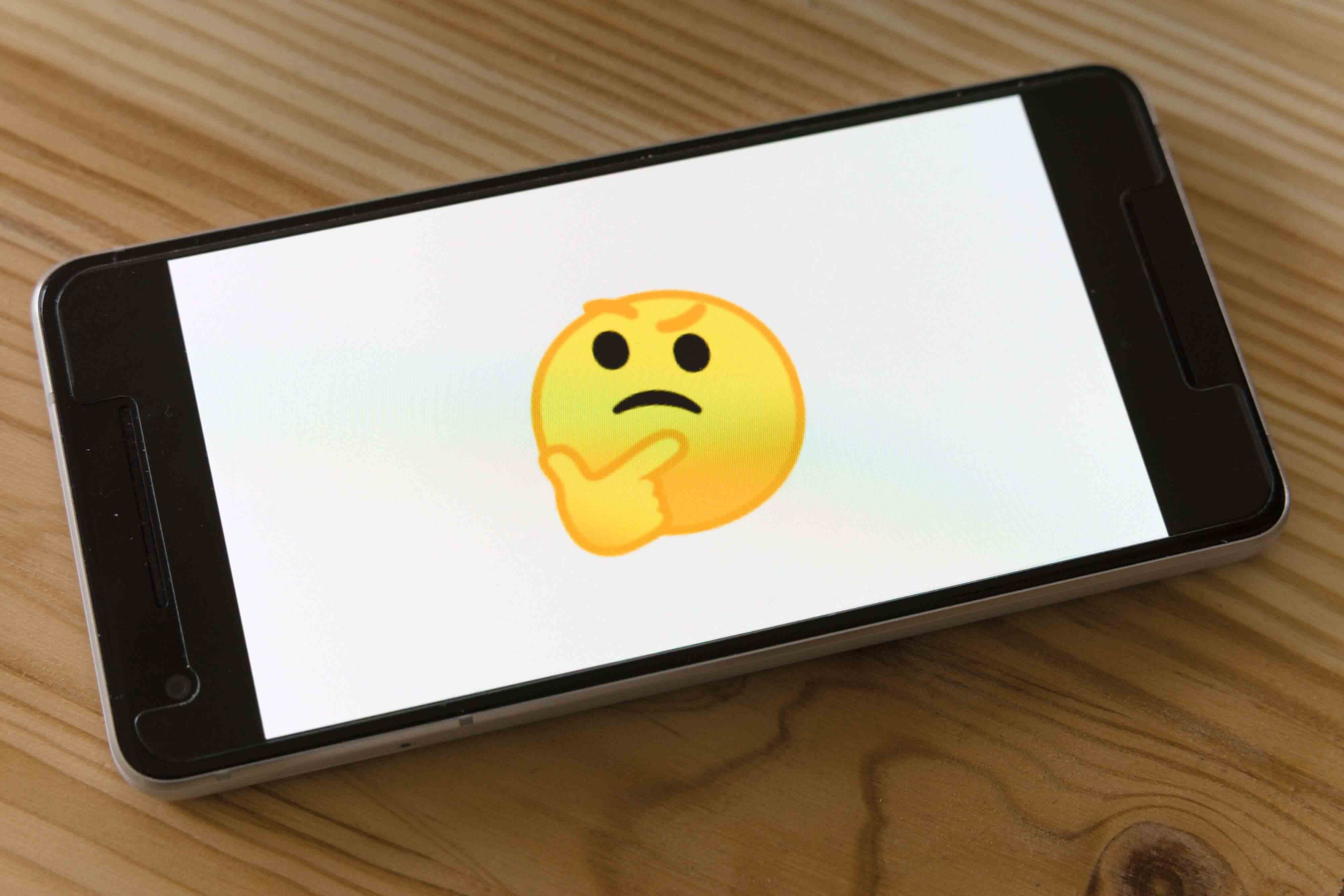 Emoji displayed on a smartphone screen, illustrating digital expression.