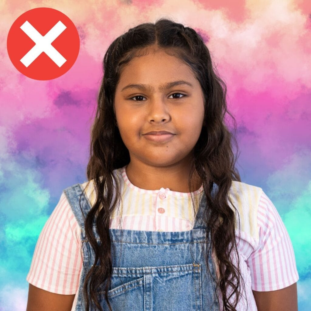 incorrect passport photo of a child with a colorful background