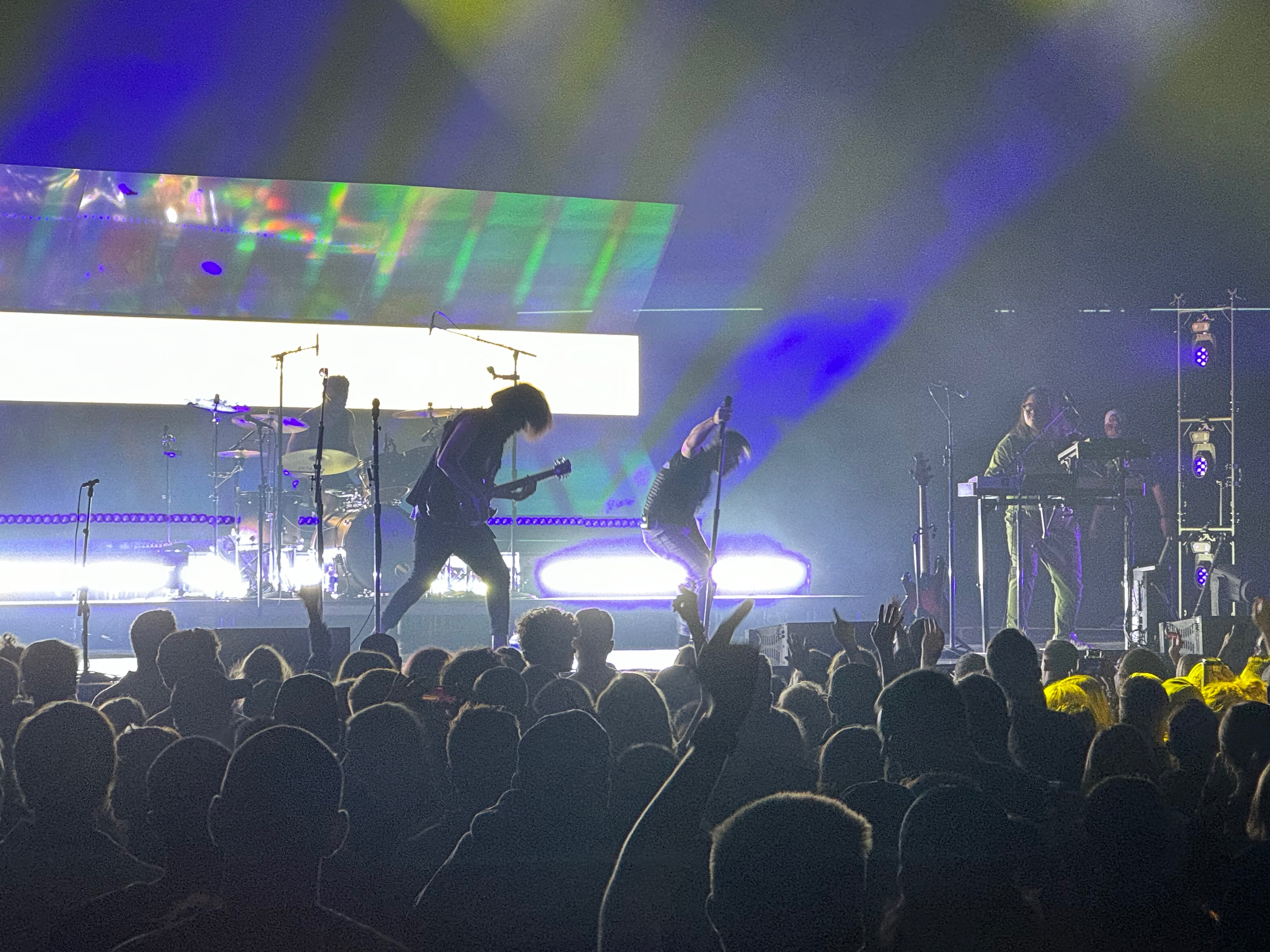 Grainy concert photo taken with iPhone 15 Pro, illustrating poor low light performance