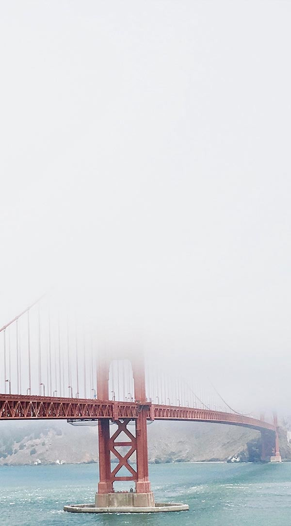 Professionally cropped photo of the Golden Gate Bridge in fog, emphasizing composition