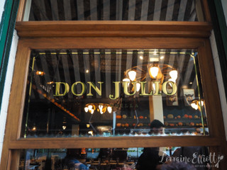 Interior dining area at Don Julio showcasing table settings and Argentinian decor