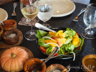 Waiter presenting a selection of steaks at Don Julio restaurant