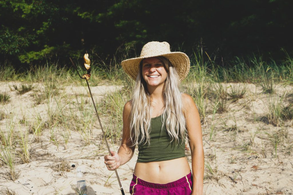 A slightly blurry, candid image of a woman laughing and walking, showcasing a realistic and unposed travel moment.