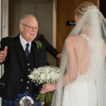 Bride and groom portrait being edited to remove distractions