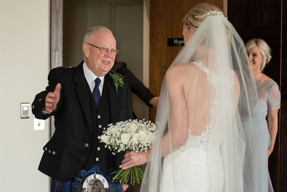 Bride and groom portrait being edited to remove distractions