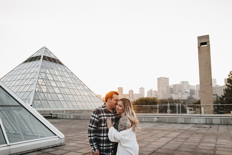 Couple amidst greenery, showcasing a top engagement photo location option