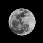 Close-up of the moon with visible craters.