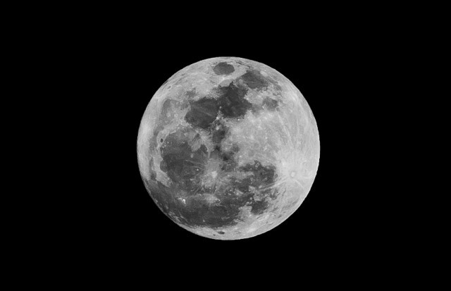 Close-up of the moon with visible craters.