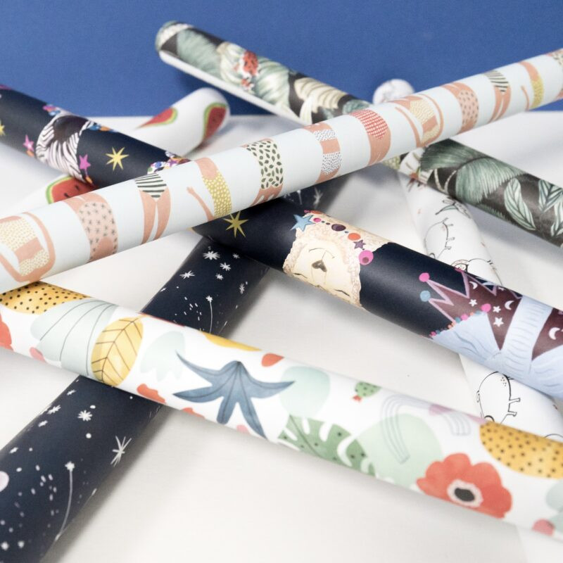 Various wrapping paper rolls and ribbons.