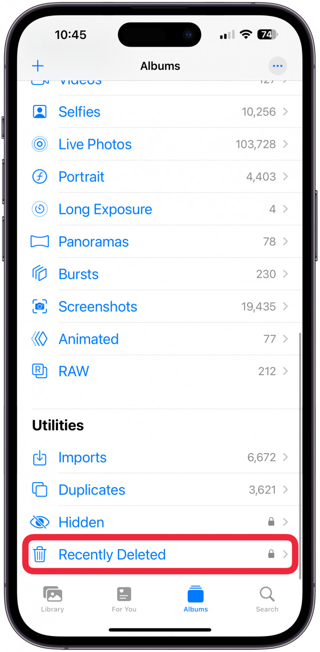 Scrolling down to the Utilities section in the Albums tab of the iPhone Photos app and selecting the Recently Deleted album.