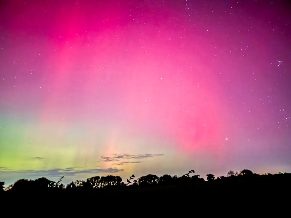 Northern lights captured on iPhone using night mode and tripod in a dark location