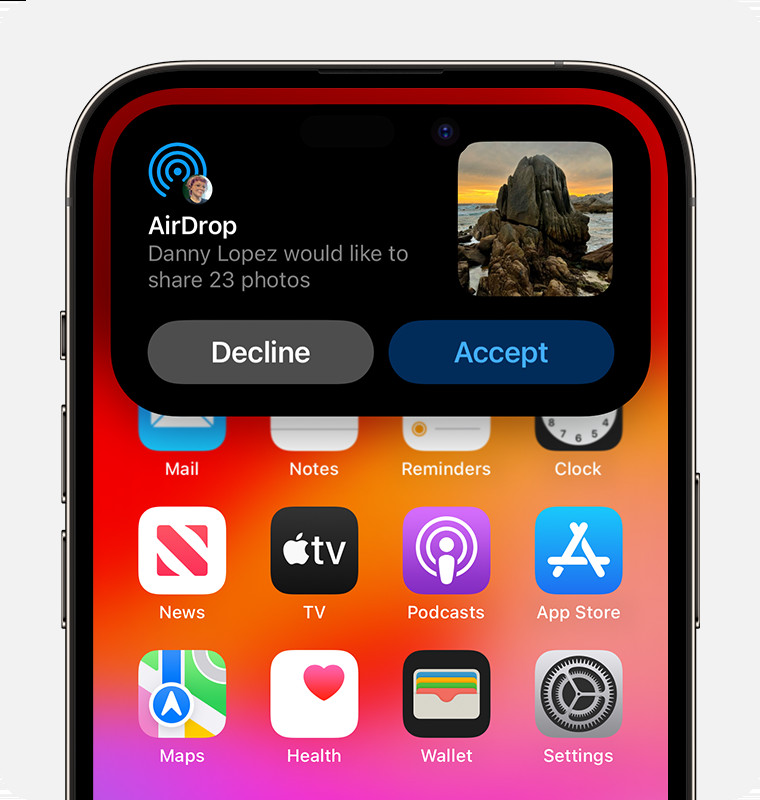 An iPhone showing an AirDrop alert with options to accept or decline the incoming transfer.