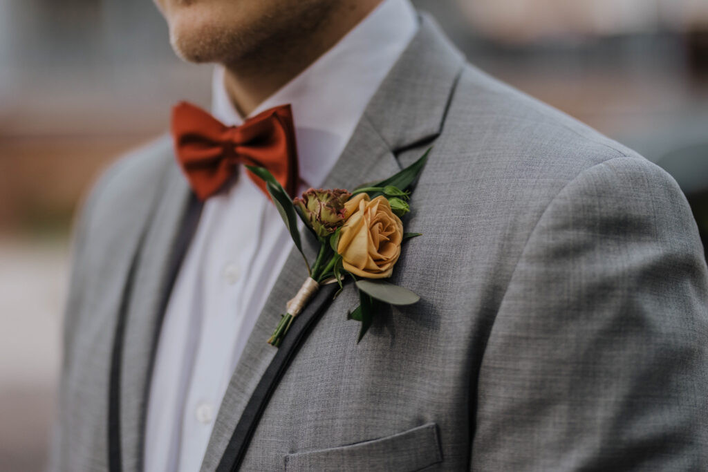 Groom watches his bride walk down the aisle at their Wilmington NC wedding ceremony