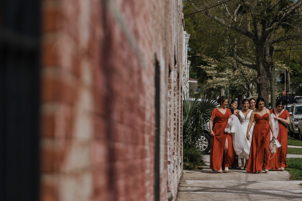 Wedding party posing for a group photo in downtown Wilmington NC