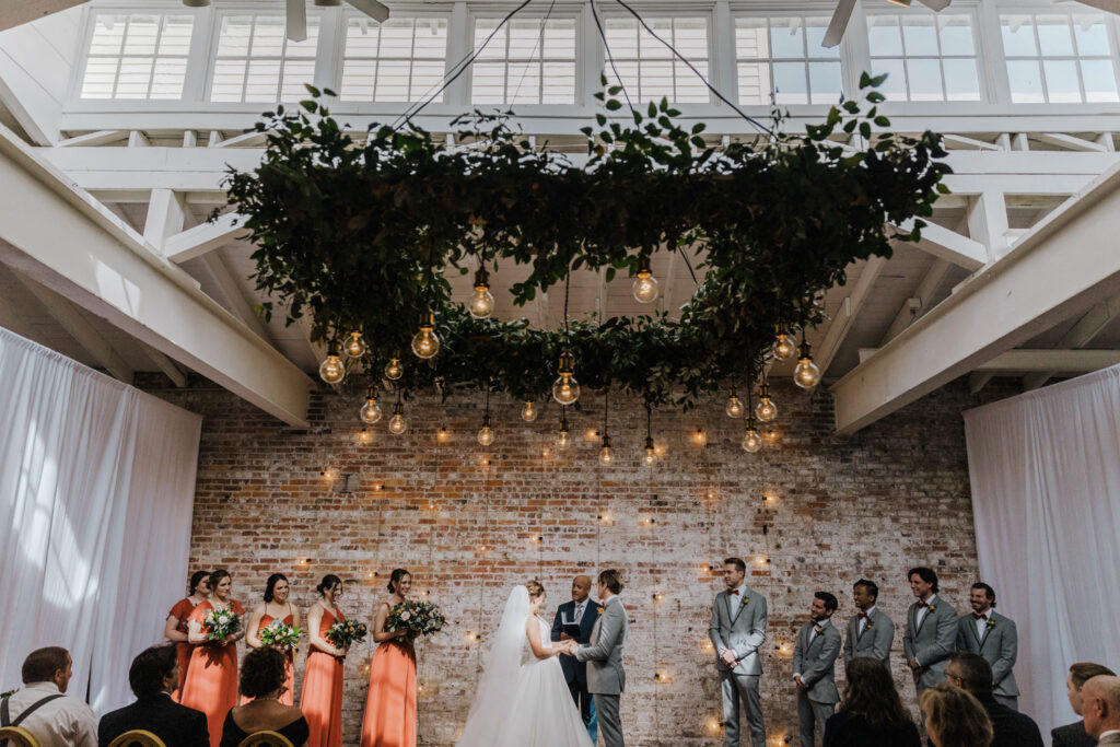 Wedding reception tablescape with floral centerpieces at Wilmington NC wedding