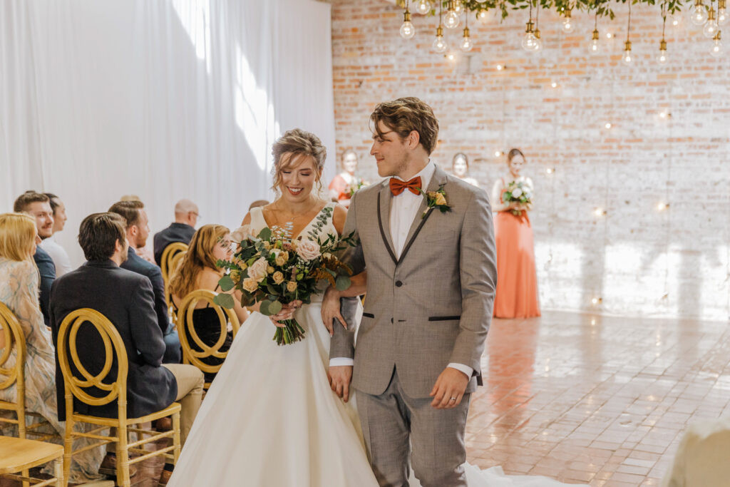 Wedding guests laughing and dancing at Wilmington NC wedding reception