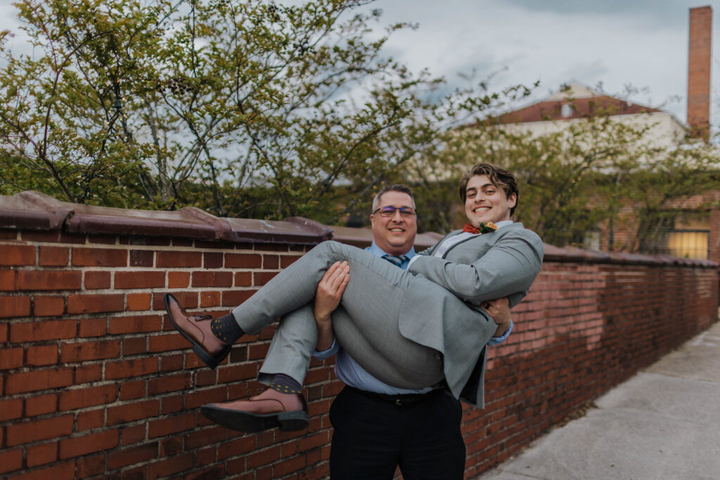 Bride and groom holding hands portrait in downtown Wilmington NC wedding