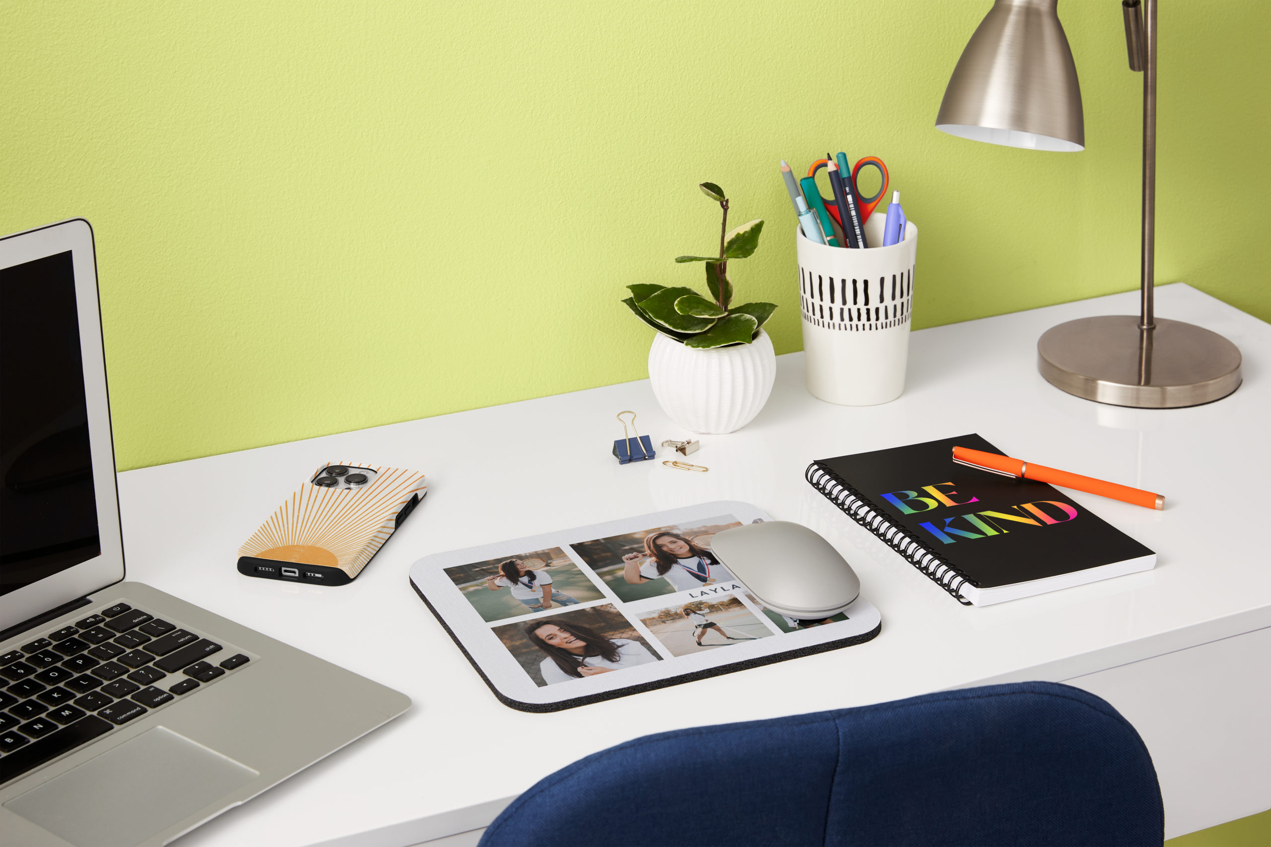 Laptop and office supplies on a desk, suggesting personalized office accessories from phone photos