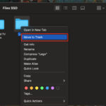 Find photos in Finder, right-click, and select Move to Trash to delete photos on a Mac using the Trash folder.