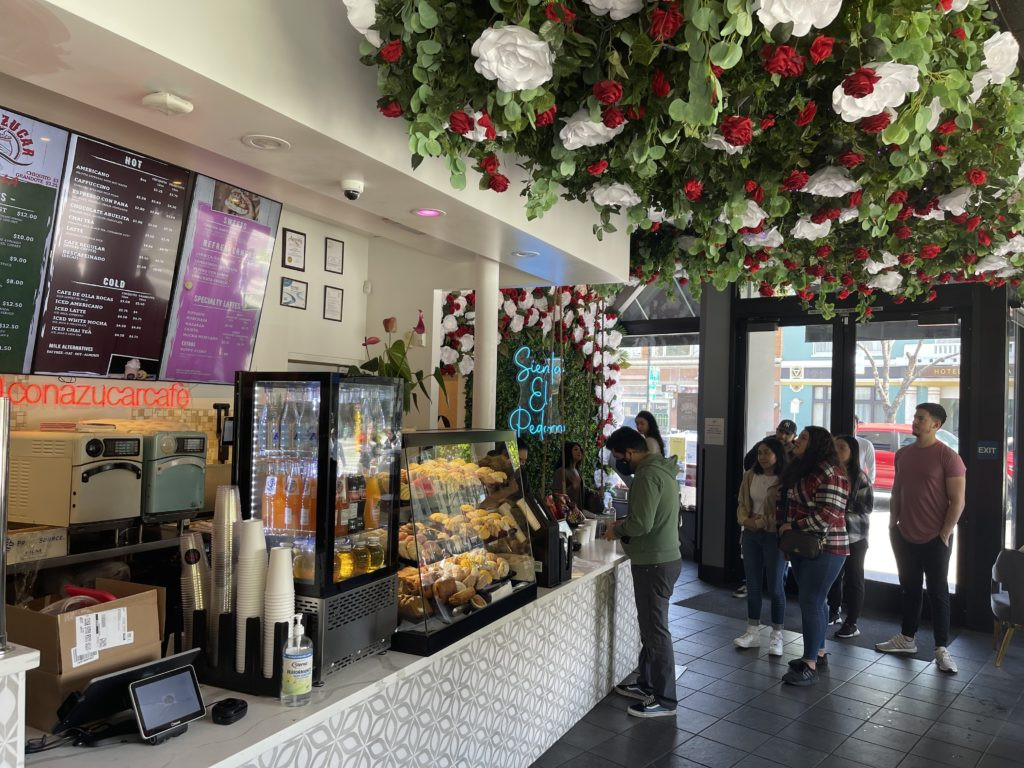 Front counter at Con Azucar Café with pan dulce display