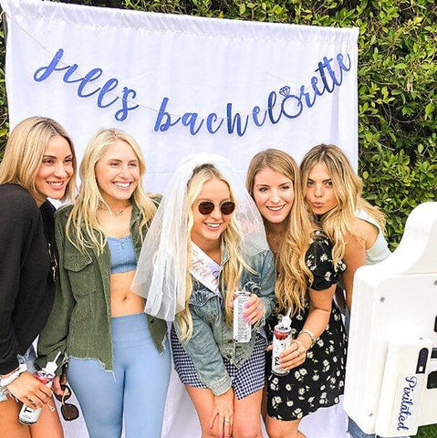 Women posing in a Pixilated photo booth at a bachelorette party