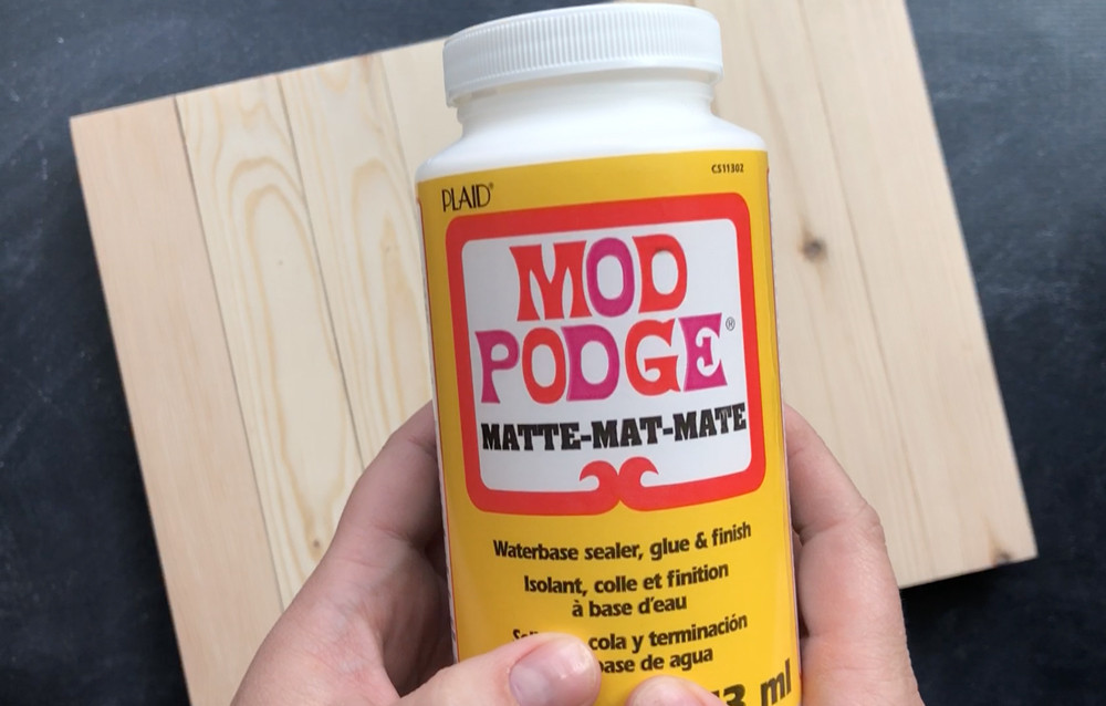 A bottle of matte Mod Podge, the essential medium for photo transfer.