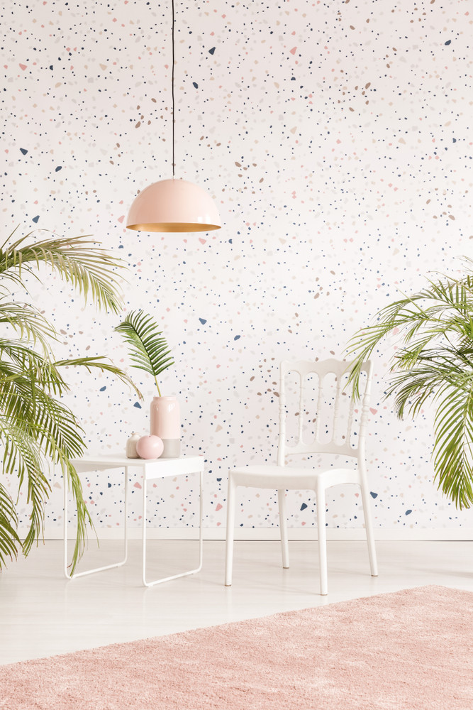 Modern pastel living room interior with white chair and plants