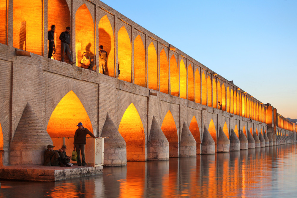 Khajoo Bridge in Isfahan, Iran at dusk with warm lighting