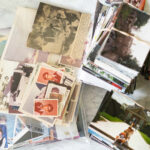 Piles of 4x6 family photos before organizing