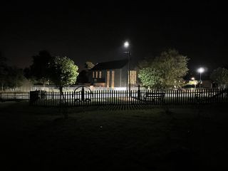 A nighttime photo captured on iPhone 13 without flash, demonstrating low-light capabilities.