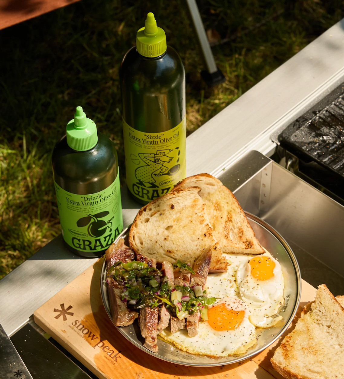 Graza's food photo, featuring steak and eggs, utilizes natural side lighting to emphasize the textures and appetizing presentation of the dish.