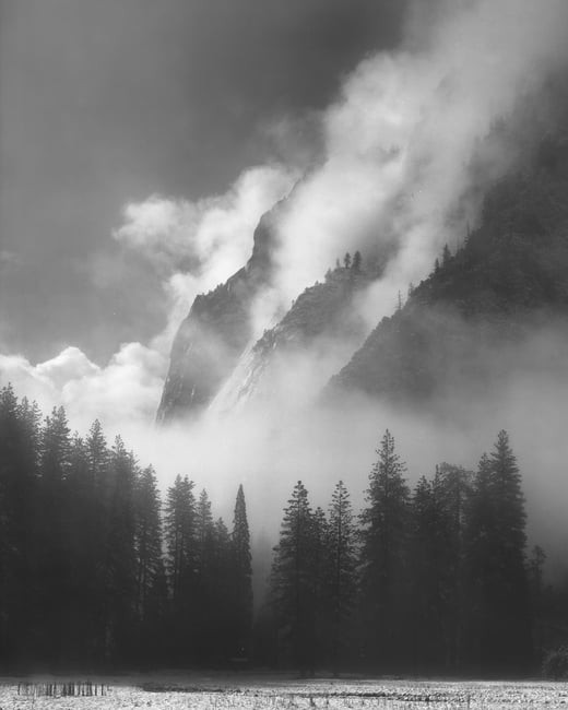 Black and white landscape photo of mist in Yosemite, showcasing artistic abstraction and timeless feel