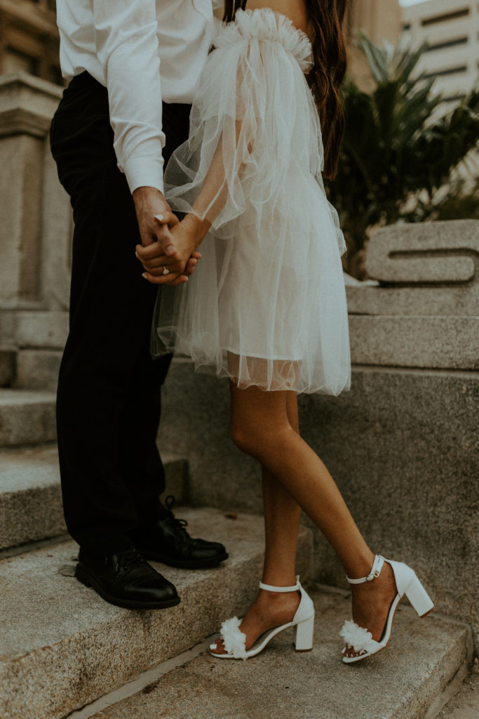 Close up engagement photo of a couple, suggesting a coordinated color scheme that could tie into their wedding palette.