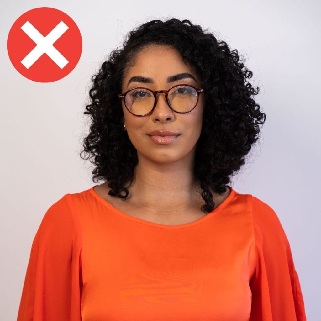 incorrect passport photo of a woman wearing glasses