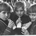 Old school photo of children drinking milk