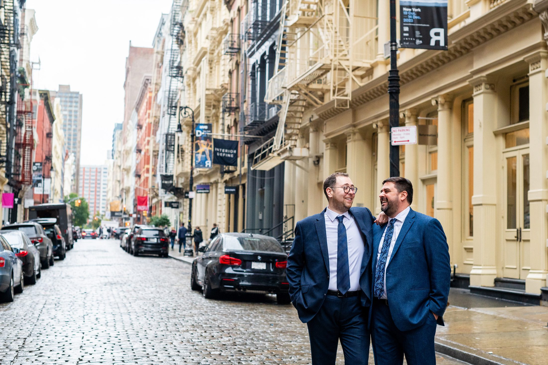 Groom in front of building in Nolita