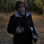Aubrey Ralph recording in the woods. (Photo by Ginger Williamson)