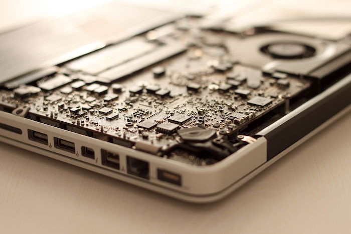 Open hard drive showcasing the internal motherboard components