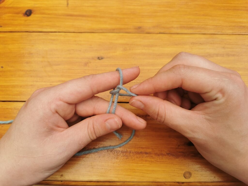Tightening the slip knot creates a secure but adjustable loop, ready for the crochet hook