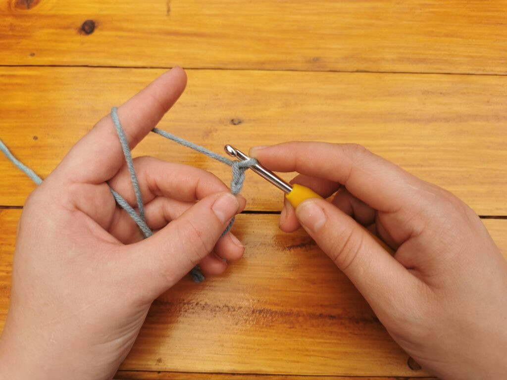 The first chain on the hook is a milestone, establishing the base for further crochet work