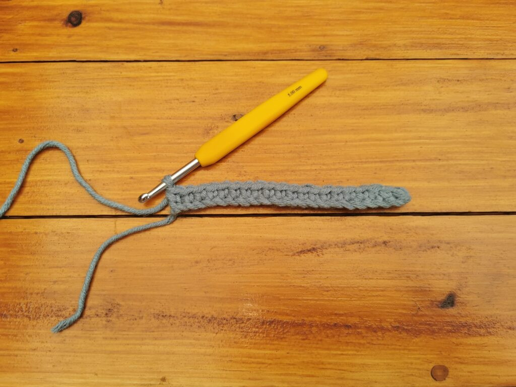 Continuing to single crochet down the chain creates a uniform row of dense stitches