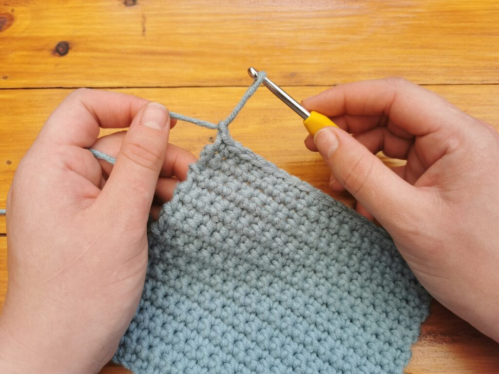 Pull the loop about an inch outward.