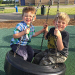 Children Playing on a Colorful Playground Structure