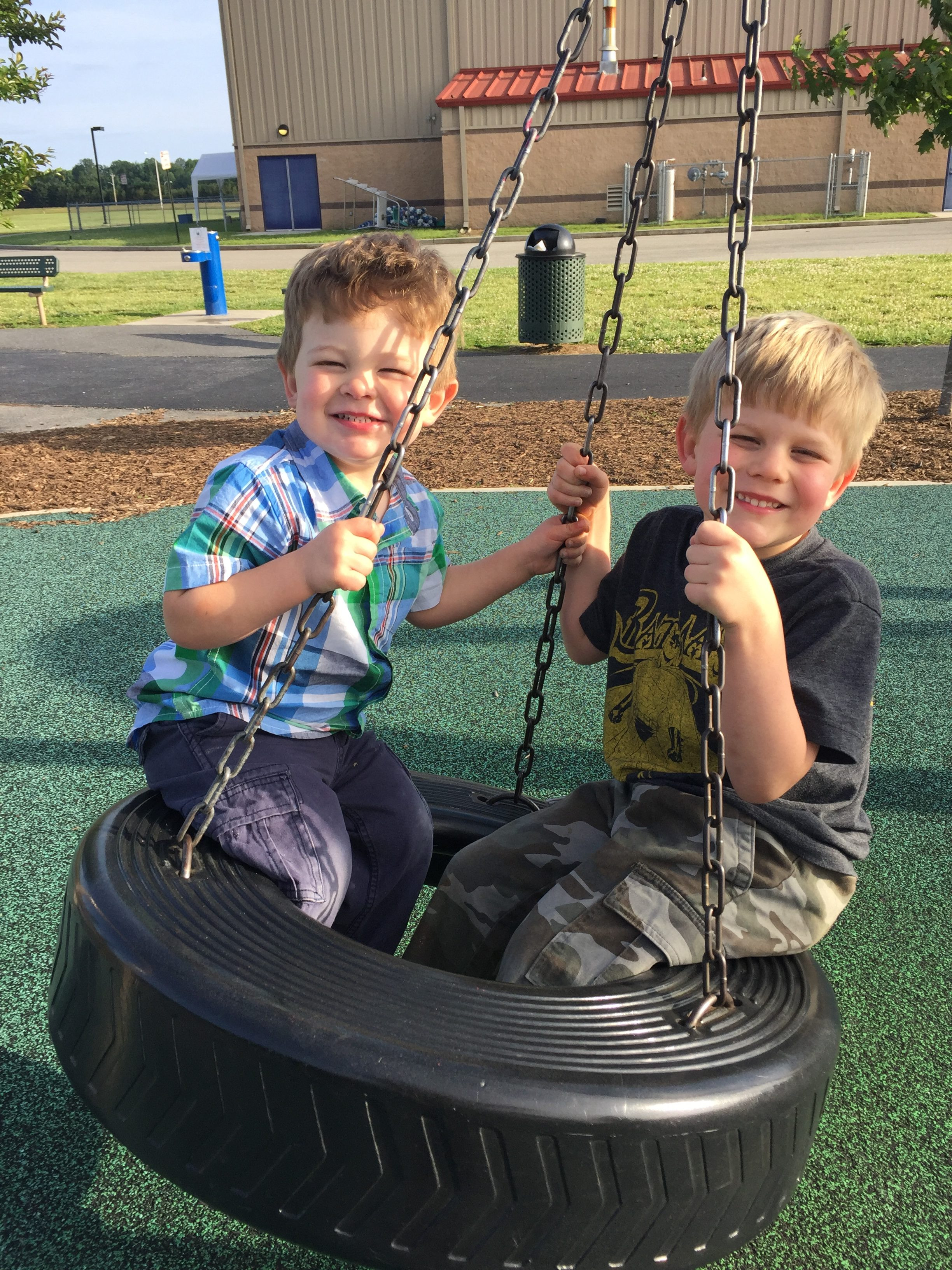 Children Playing on a Colorful Playground Structure