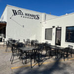 Exterior shot of Will Henry's Tavern in Monroe, Georgia, highlighting the location at 138 N. Madison Ave