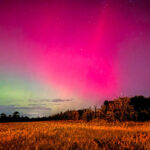Northern Lights captured with iPhone, showing vibrant green and pink hues