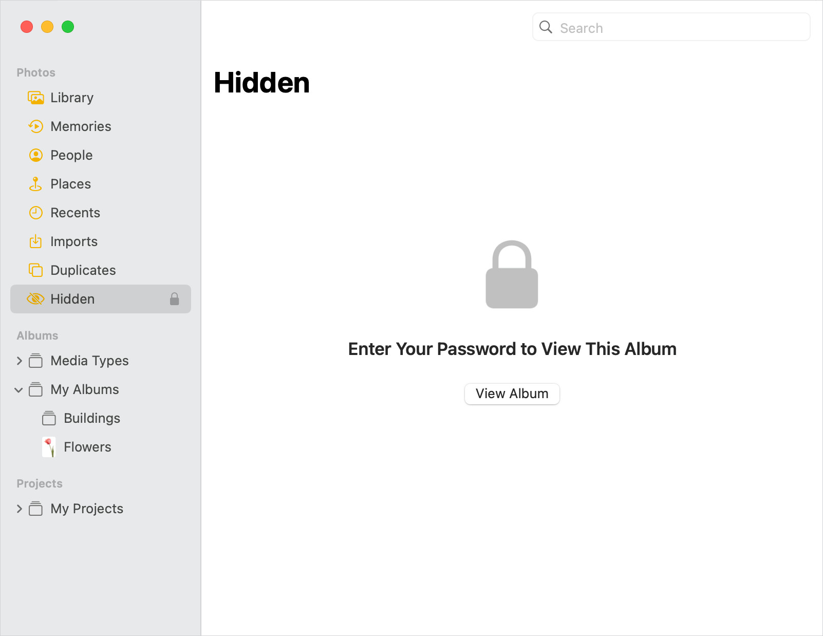 Screenshot of the Photos app window showing that the Hidden album is locked