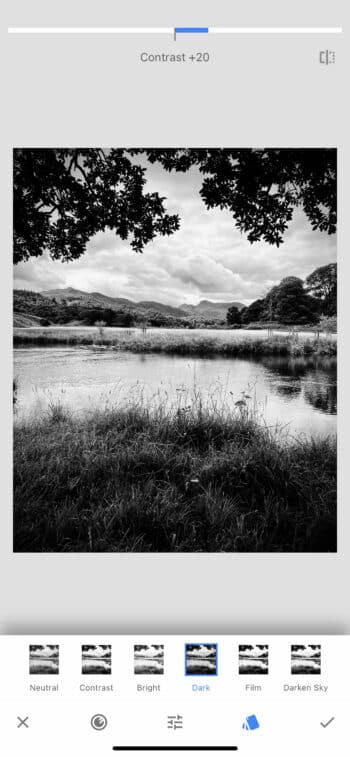 Snapseed interface on iPhone, displaying editing tools for black and white photography